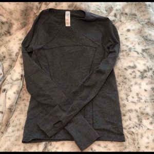 A set of two grey long sleeve ivivva tank tops